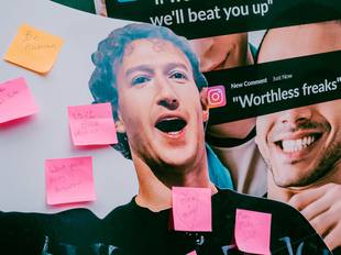 Photo from All Out's offline action targeting Meta. The image shows a cut out of Mark Zuckerberg with handwritten post it notes from passers, including comments like "Make Meta Safe Again."